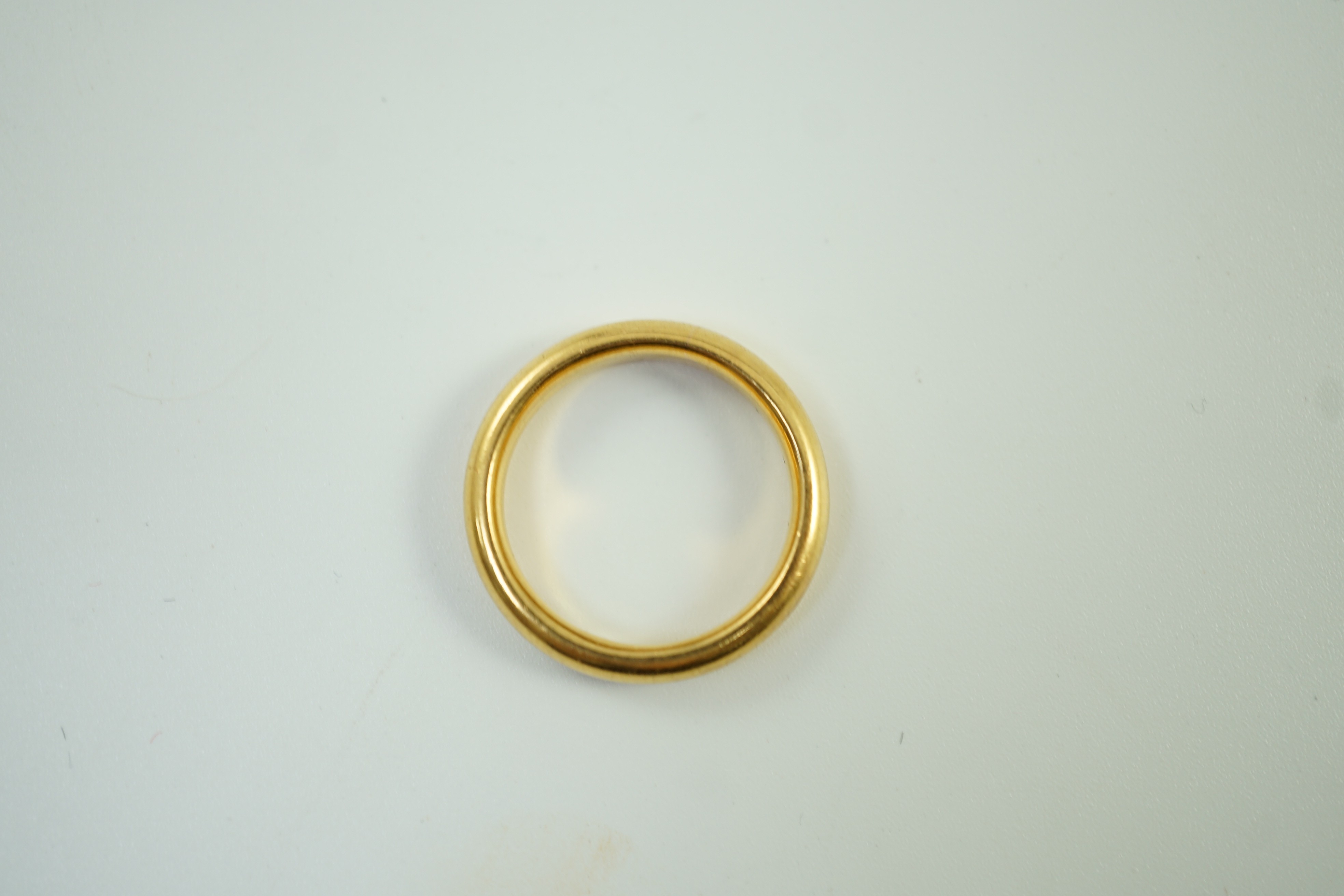 A 1930's 22ct gold wedding band, size M, 7.8 grams.